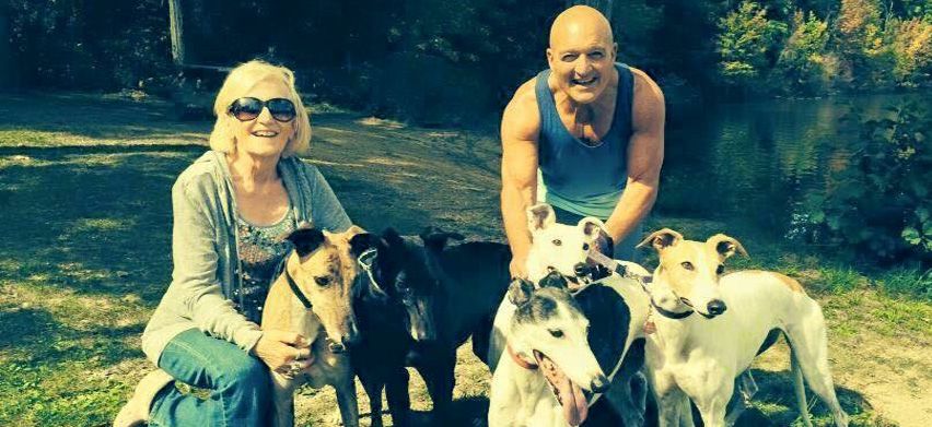 Vince and wife Sue enjoy some time in the park with their greyhounds.